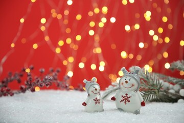 Poster - Cute decorative snowmen on artificial snow, space for text