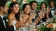 © fourtakig - Joyful Bridal Party Toasting with Champagne Flutes at Reception Celebration