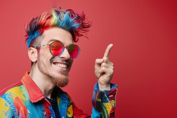 Distinctive young man shows off his colorful hair and confident charm. Handsome man trendy hair look and charming cheerful expression. Charm and confidence stemming from appealing colorful appearance.