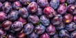 © Udomner - Background texture of ripe purple plums top view, plums, ripe, purple, juicy, background, texture, fresh, fruit, organic