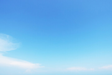 Wall Mural - fantastic soft white clouds against blue sky and copy space horizontal shape