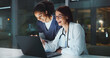 © HockleyM3/peopleimages.com - Night, laughing or doctor with surgeon on laptop reading online for news update or late schedule in hospital. Medical results, smile or happy women with technology, clinic website or telehealth app