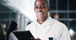 © PeakPoints/peopleimages.com - Black man, doctor and tablet at hospital, portrait and night with report, results and medical research. Person, medic and app with digital touchscreen for review, feedback and healthcare in Nigeria