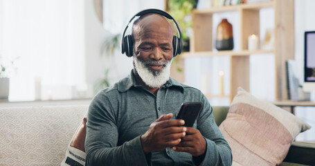 Home, headphones and senior man with smartphone, typing and social media with internet, connection and sound. Good news, pensioner and mature person with headset, cellphone and mobile user with radio