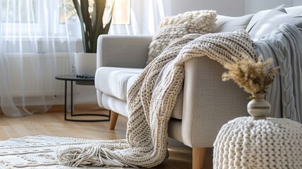 Sticker - Contemporary Scandinavian interior decor with cozy living area, knitted blanket, wood floor. Elegant rental apartment idea.