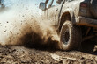 © Kitta - Dust Devil: A rugged off-road truck kicks up a cloud of dirt as it speeds through a challenging terrain.