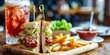 © TheWaterMeloonProjec - Classic diner offering fast food featuring a club sandwich, fries, lettuce, BBQ sauce, ketchup, and a refreshing beverage served in a wooden tray.
