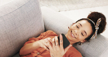 Poster - Happy woman, relax or lying with phone on sofa for social media, online browsing or chatting at home. Young, female person or user with smile on mobile smartphone for texting, message or app at house