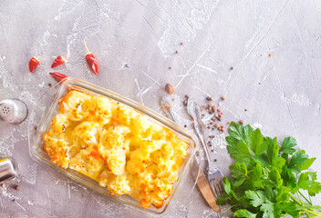 Wall Mural - Cauliflower cheese in a baking dish on a table