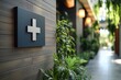 © Gatherina - Modern clinic sign with plants showing sustainable healthcare concept