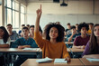 © SejutaCahaya - A young Black girl raises her hand to answer a question in a classroom full of students.