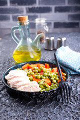 Poster - Savory vegetable stew with chicken fillet on plate on a table