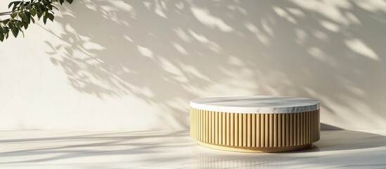 Poster - Minimalist luxury cylindrical podium featuring wooden slats and a white marble top against a white wall complemented by a tree shadow background for product display 3D render illustration