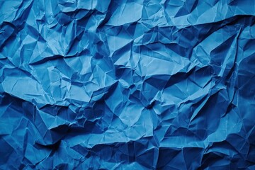 Poster - Crumpled blue paper texture background with rough uneven surface. Close-up view of folded, creased blue sheet. No text or objects visible. Perfect for graphic design, digital art, creative projects.