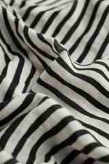 Poster - Close-up of black and white striped fabric with wrinkled texture. Evenly spaced stripes create rhythmic pattern on cotton material. No text or objects visible. Fabric appears smooth and textured.