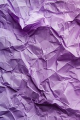 Poster - Crumpled purple paper texture with intricate folds. Close-up view of creased and curled edges. Black and white background highlights textured surface. Perfect for design, art, or creative projects.