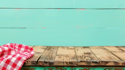 Poster - Wooden deck table with red checkered cloth on mint wallpaper background