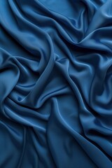 Poster - Blue fabric texture pattern close-up view. Crumpled silk or satin material folded to create depth and dimension. Overlapping folds form intricate design. Blurred background focuses on fabric details.