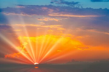 Sunset dramatic sky background with sun and sunset clouds