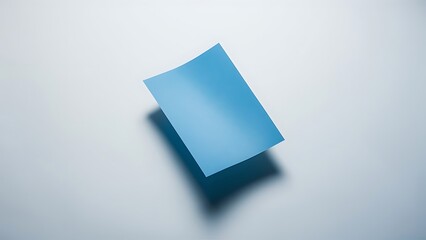 Top view of empty blue paper on white background