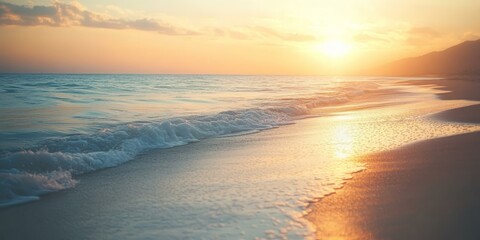 Poster - Golden sunset over calm ocean waves on sandy beach.