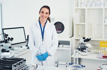 Science, research and portrait of woman in laboratory with smile for vaccine development in medical study. Biotech engineer, technician or confident scientist in office for pharmaceutical innovation