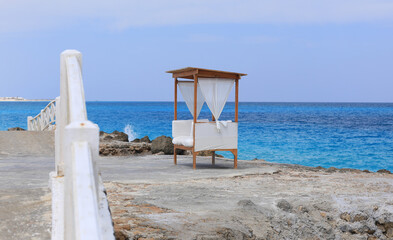 Wall Mural - seaside resort beach with white sand and a gazebo for relaxation