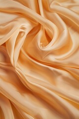 Poster - Close-up view of orange fabric with intricate texture and layers. Fabric folded in half revealing its vibrant color and texture. Simple gray background contrasts with the orange hue.