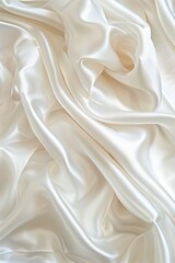 Aufkleber - White fabric texture possibly silk satin material folded in half, revealing intricate structure. Gray background contrasts with vibrant fabric for a striking composition.