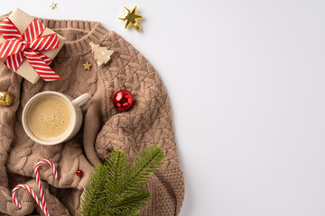 Wall Mural - Warm and festive flat lay featuring a knitted sweater, coffee, and Christmas ornaments with candy canes and gift