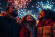 © Alexandra - Happy family is watching fireworks exploding in the sky on new year's eve