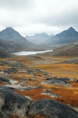 Poster - A mountain range with a lake in the foreground. The sky is cloudy and the mountains are covered in snow