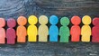 © nikolettamuhari - Colorful wooden human figures arranged in a row representing diversity