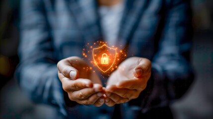 businessman in a suit holding a glowing shield icon with a padlock in the center, symbolizing cybersecurity or data protection