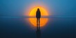© raja - Silhouette of a Woman Standing on a Beach with a Sunset in the Background