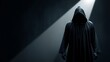 © Ruslan Abdullin - Mysterious hooded figure in darkness with spotlight.