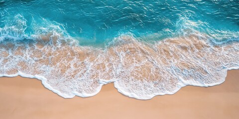 Beautiful sandy beach with gentle blue ocean waves.