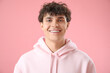 © Pixel-Shot - Portrait of handsome young man pink on background