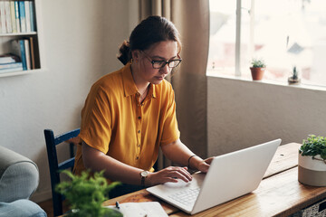 Poster - Woman, laptop and remote work for planning in home, online and research for writing article. Female person, check report and editing language on transcription, typing and upload journal on website