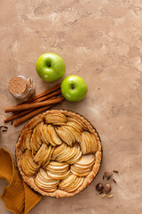 Wall Mural - Apple pie or tart filled with sliced apples arranged on a pie base