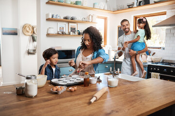 Wall Mural - Baking, cupcake and parents with children in kitchen for bonding, food and learning. Cooking, love and help with people and ingredients in family home for breakfast, teaching and happiness together