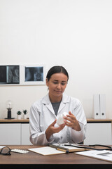 Poster - Digital Health Consultation: female doctor presents a bottle of pills or vitamins on her desk, offering expert advice and prescribing medication to the patient. 