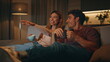 © stockbusters - Excited family watch comedy movie have good time evening room together closeup