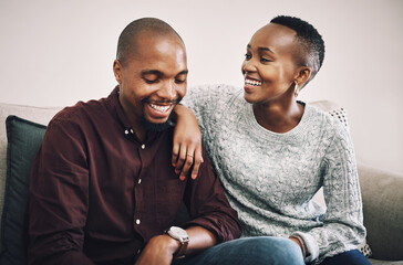 Poster - Black couple, laughing and love on sofa at house for funny relationship, bonding and commitment together. Smile, people and embrace for partner support, communication and comic joke of loyalty trust