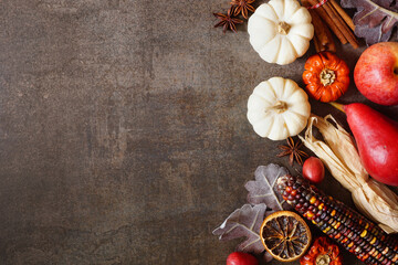 Aufkleber - Autumn border of pumpkins, leaves and baking spices. Side border on a dark stone background with copy space. Overhead down view.