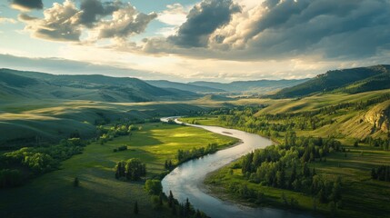 Wall Mural - River Winding Through a Lush Valley Under a Cloudy Sky