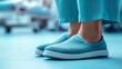 © Pixel Chaser  - Side View of Worn Hospital Slipper on Foot