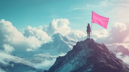 woman standing on mountain peak with pink flag