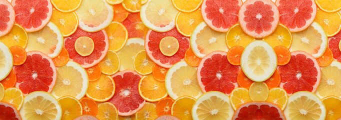 Wall Mural - Citrus fruits cut into round pieces: orange, grapefruit, lemon, tangerine. Ripe and juicy fruits