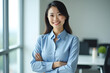 © Amir Bajric - business woman with crossed arms posing in the office